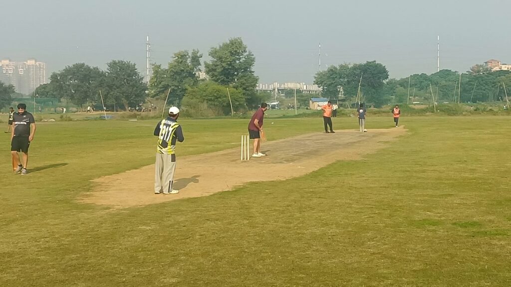 Kingslayer batting first in a 20-over tennis-ball cricket match, seen from square leg