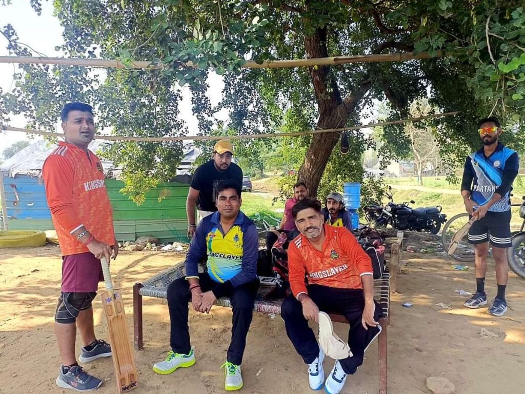 Kingslayer players waiting in the shade before the toss at M2 Ground